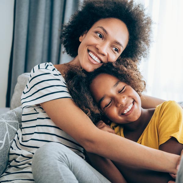 smiling mother and daughter