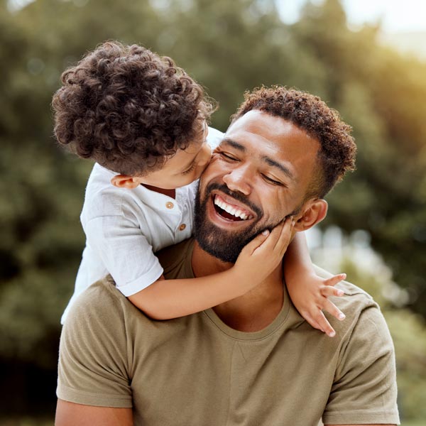 smiling father and son